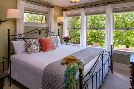 Parkview room with king bed, private bath, gas fireplace, view of park and lake.