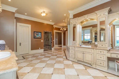 Primary bathroom with walk-in steam shower and heated tile flowers